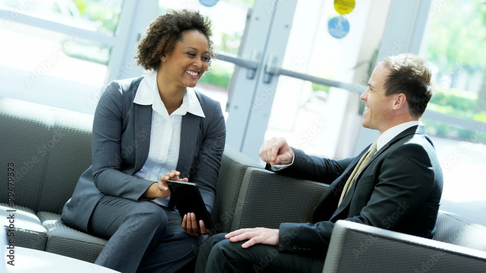 African American Caucasian male female office finance banking tablet technology African American Caucasian male female office finance banking tablet technology