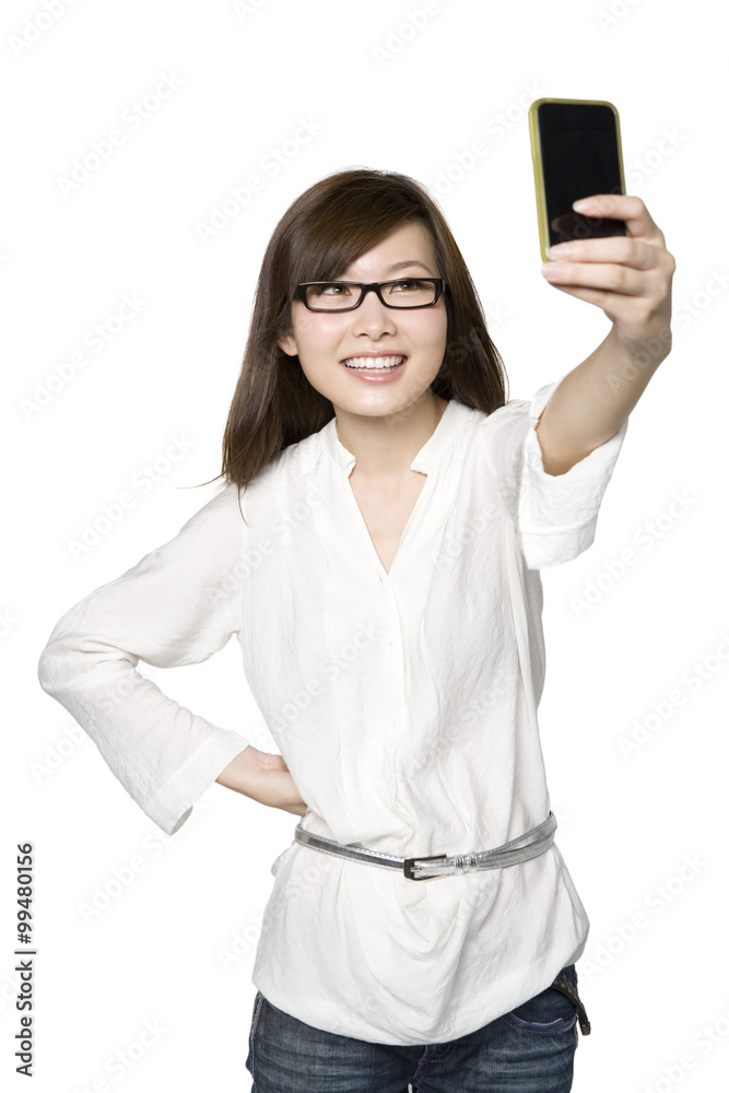 Portrait of Young Woman Taking a Photograph of Herself Portrait of Young Woman Taking a Photograph of Herself