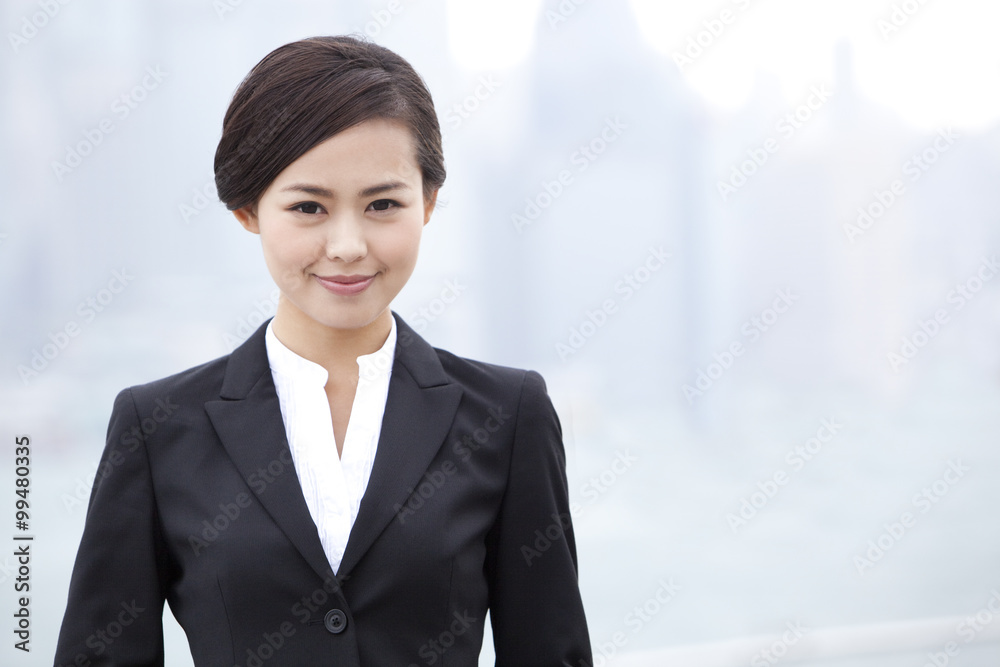 Elegant businesswoman in Victoria Harbor, Hong Kong Elegant businesswoman in Victoria Harbor, Hong Kong