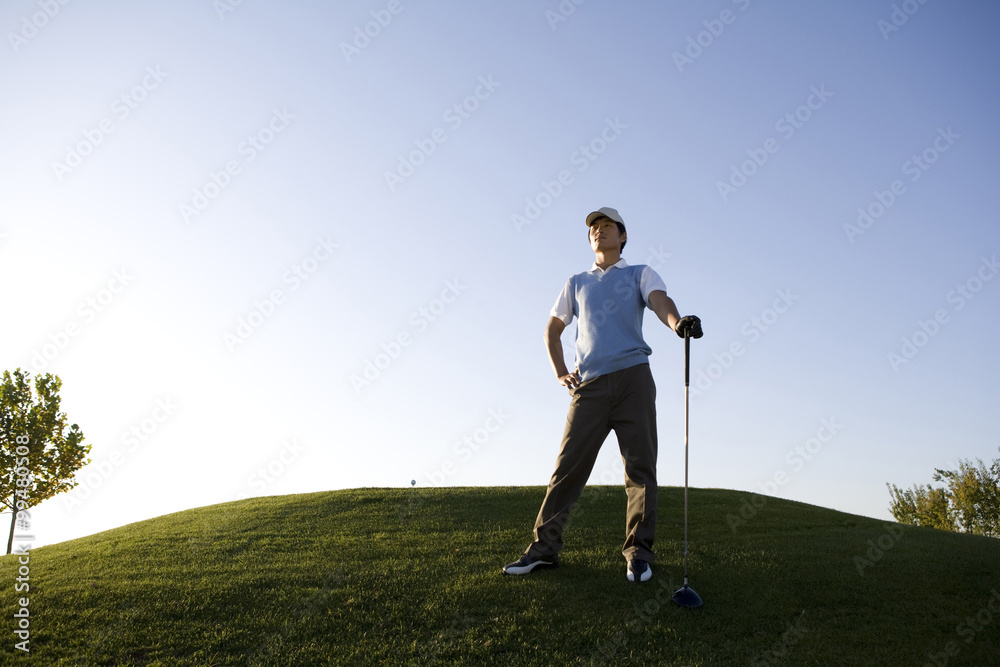 Golfer taking a rest on the course