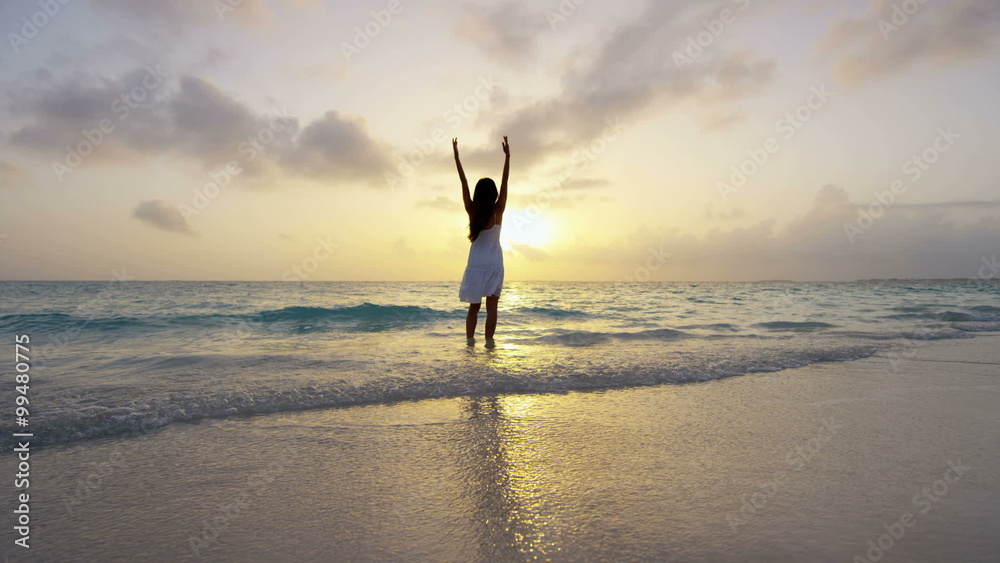 Carefree ethnic girl at luxury resort dancing barefoot Carefree ethnic girl at luxury resort dancing barefoot