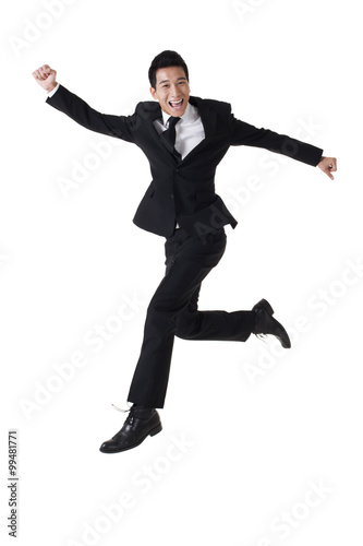 Businessman leaping in the air