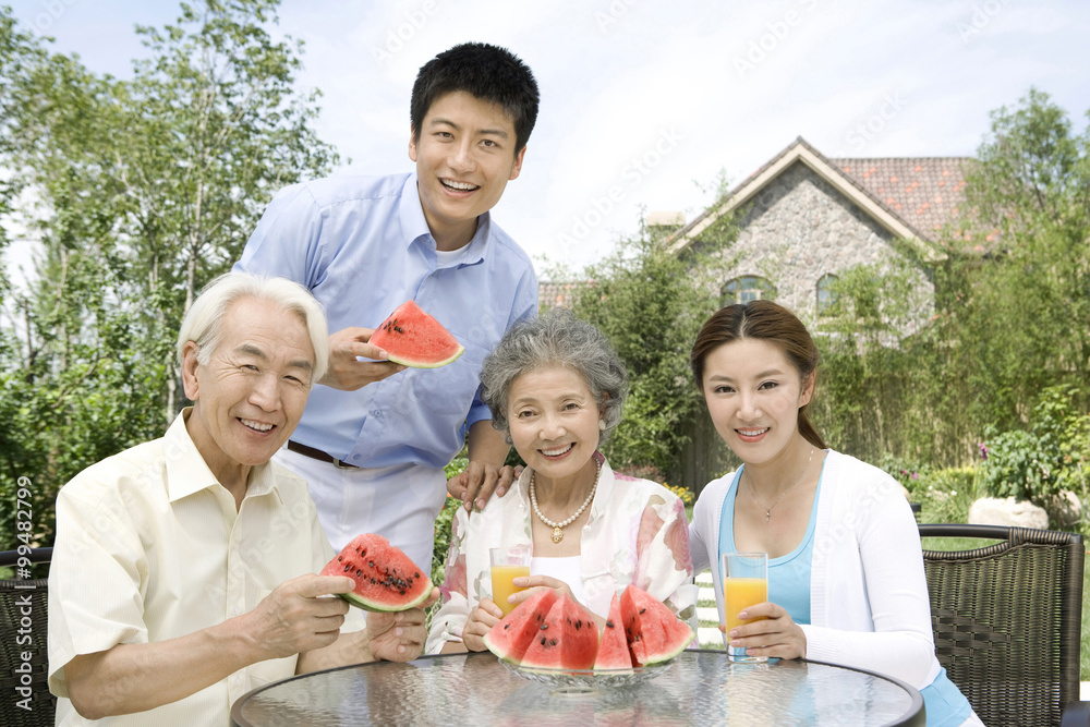 Family eating watermelon Family eating watermelon