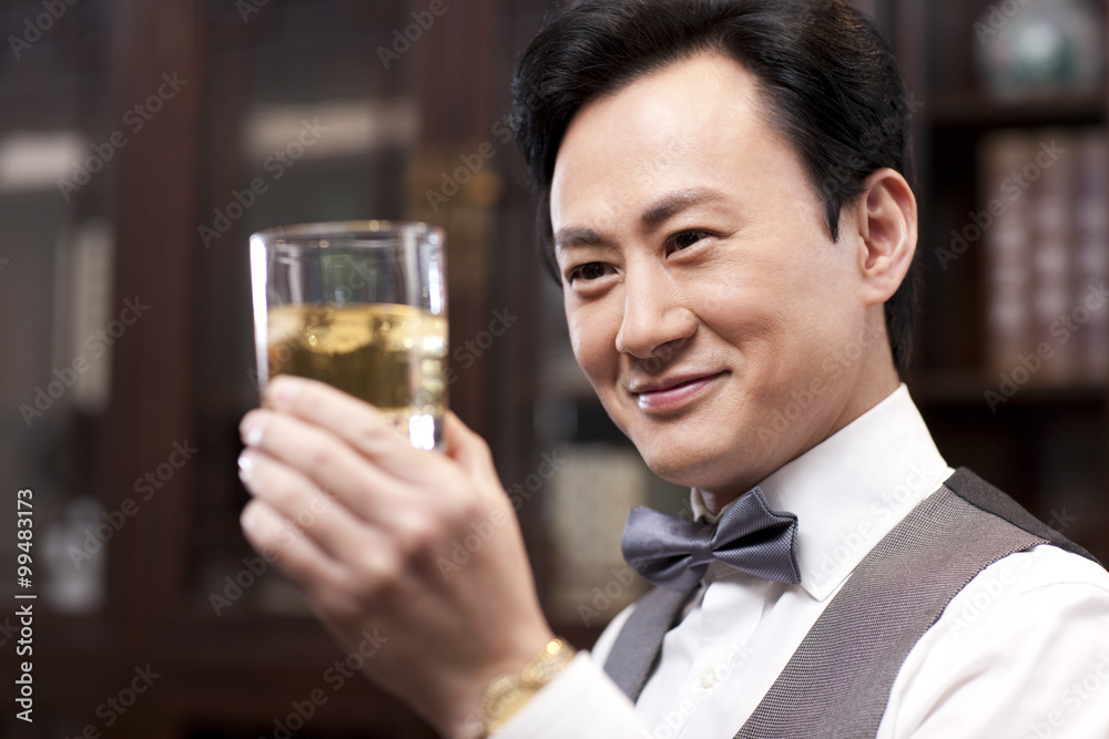 Businessman appreciating fine wine Businessman appreciating fine wine
