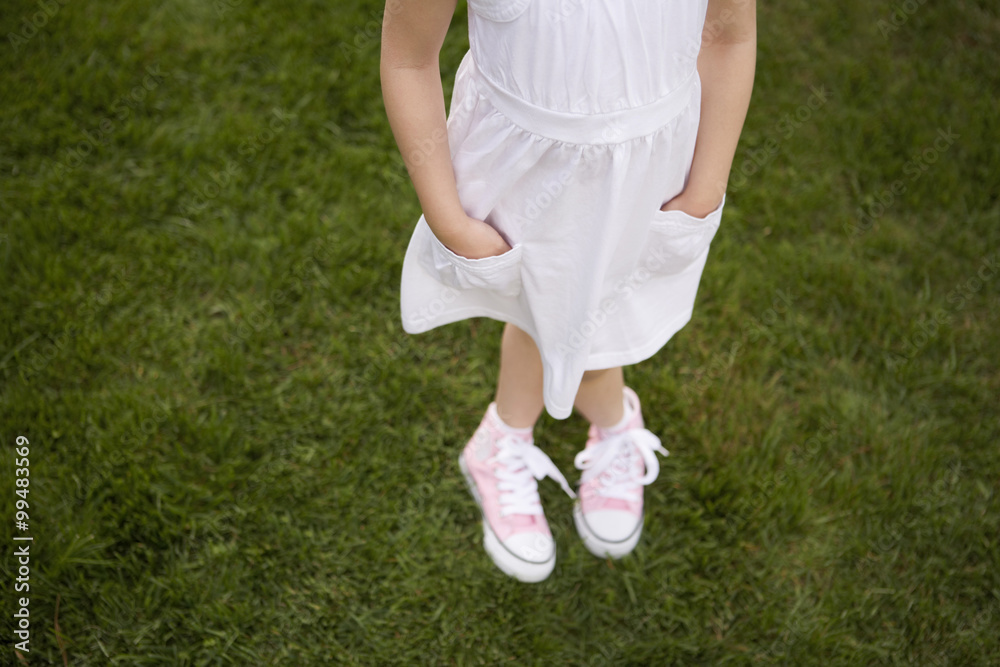 Young Girl Standing In Park Young Girl Standing In Park