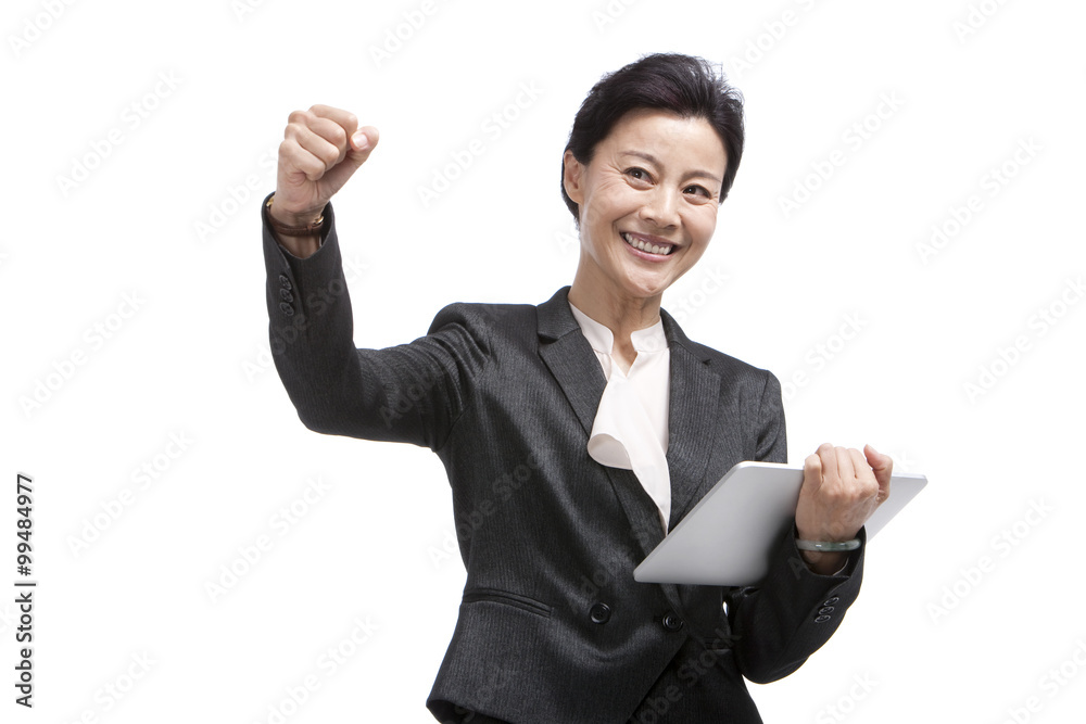 Middle-aged businesswoman using digital tablet Middle-aged businesswoman using digital tablet