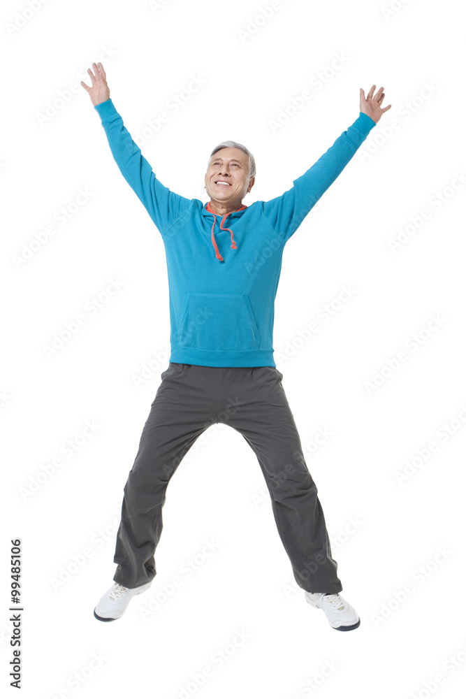 Senior man jumping in the mid-air Senior man jumping in the mid-air