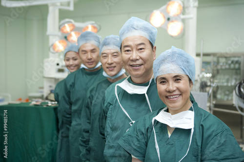 Portrait of a team of surgeons standing in a line