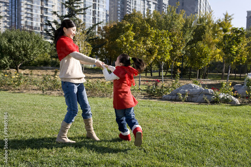 Mother and Daughter Playing in a Park