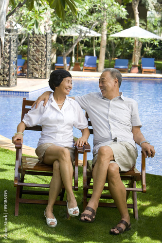Portrait of a senior couple by the pool