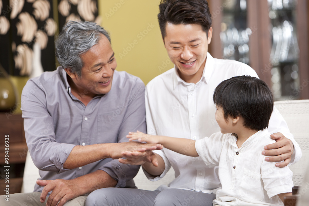 Three generations of men having fun at home Three generations of men having fun at home