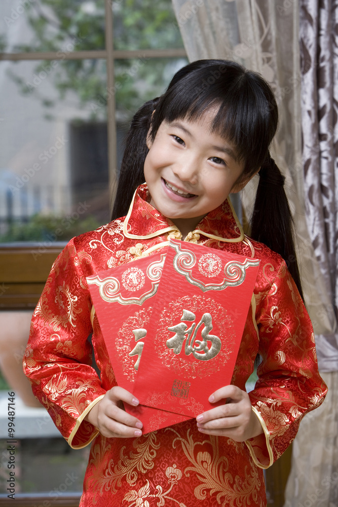 Portrait of a girl holding Chinese red envelope Portrait of a girl holding Chinese red envelope