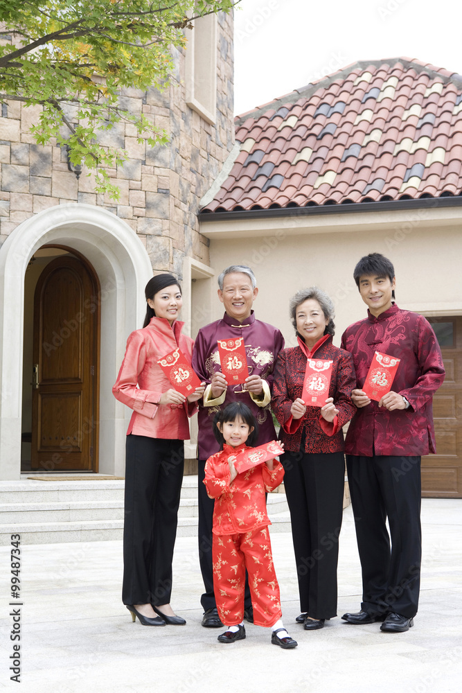 Three generation family holding Chinese new year red envelope Three generation family holding Chinese new year red envelope