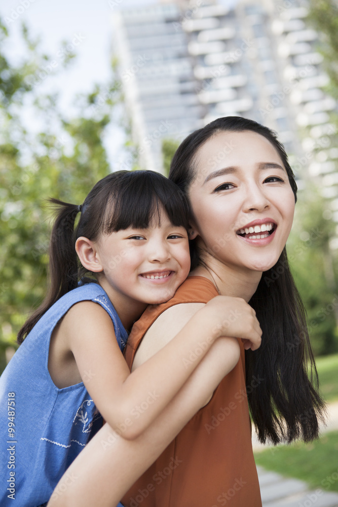 Portrait of happy mother and daughter