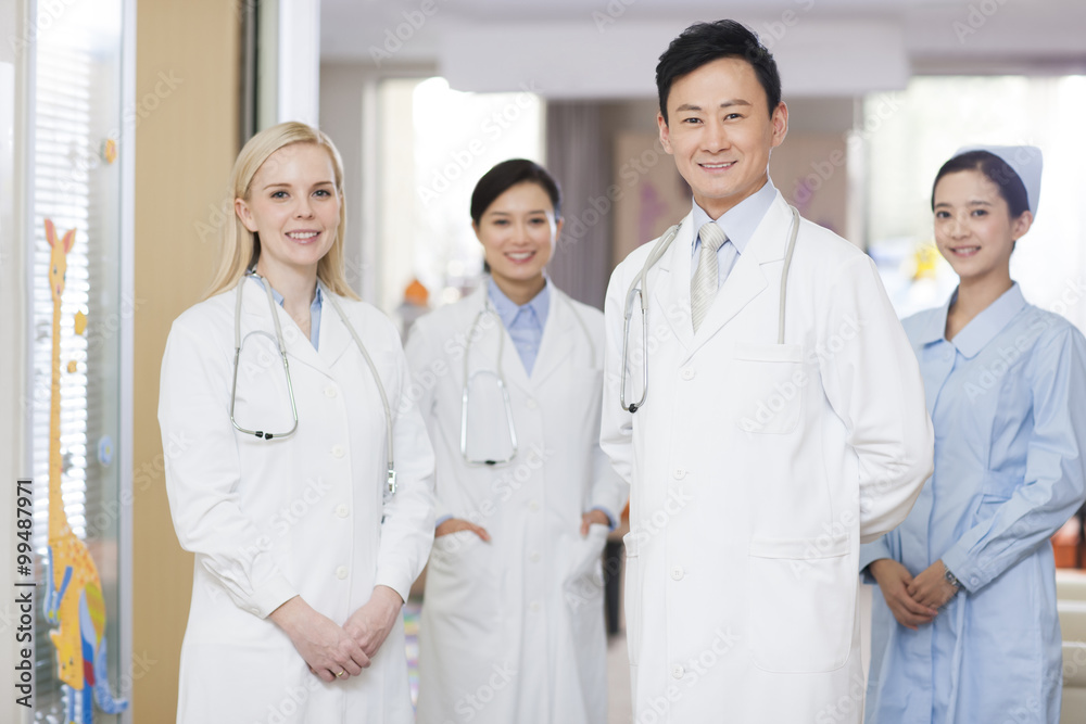 Confident doctors and nurse in children's hospital Confident doctors and nurse in children's hospital