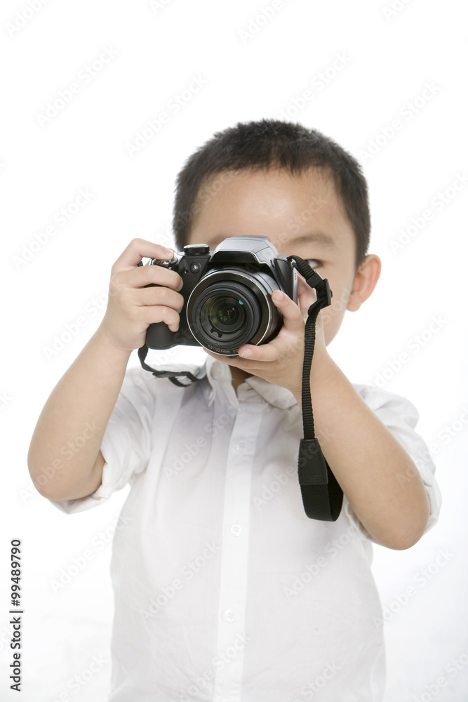 Little boy taking photo by digital camera Little boy taking photo by digital camera