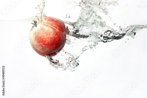 Peach Splashing in Water
