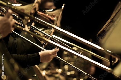 Canvas Print Hands of man playing the trombone in the orchestra