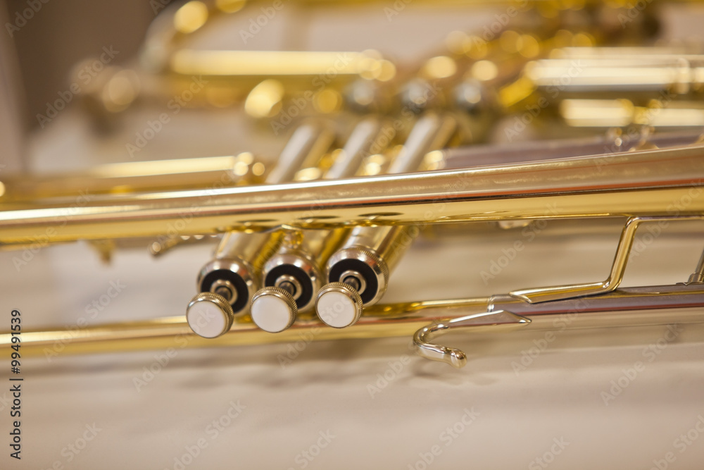 Obraz premium Detail of the trumpet closeup in golden tones