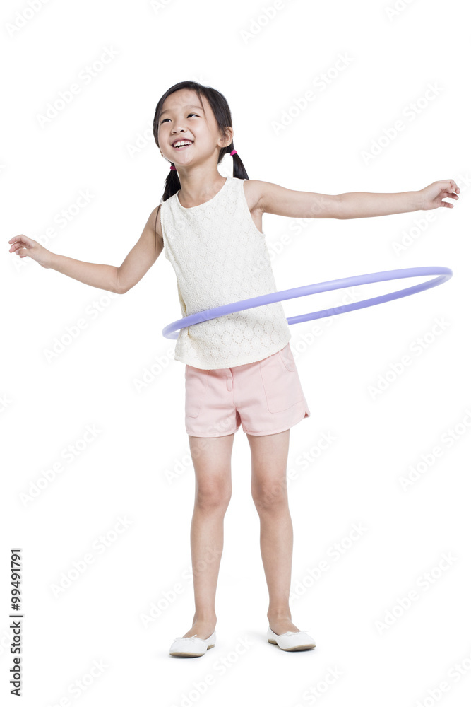 Happy girl spinning plastic hoop Happy girl spinning plastic hoop