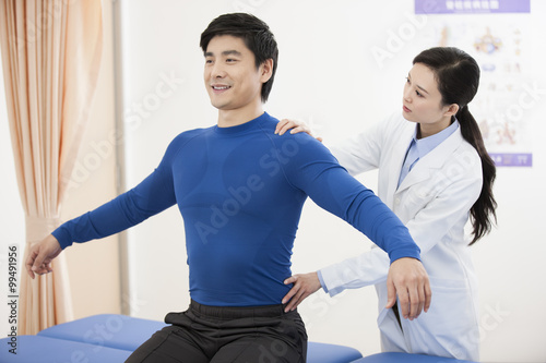 Female doctor examining patient photo