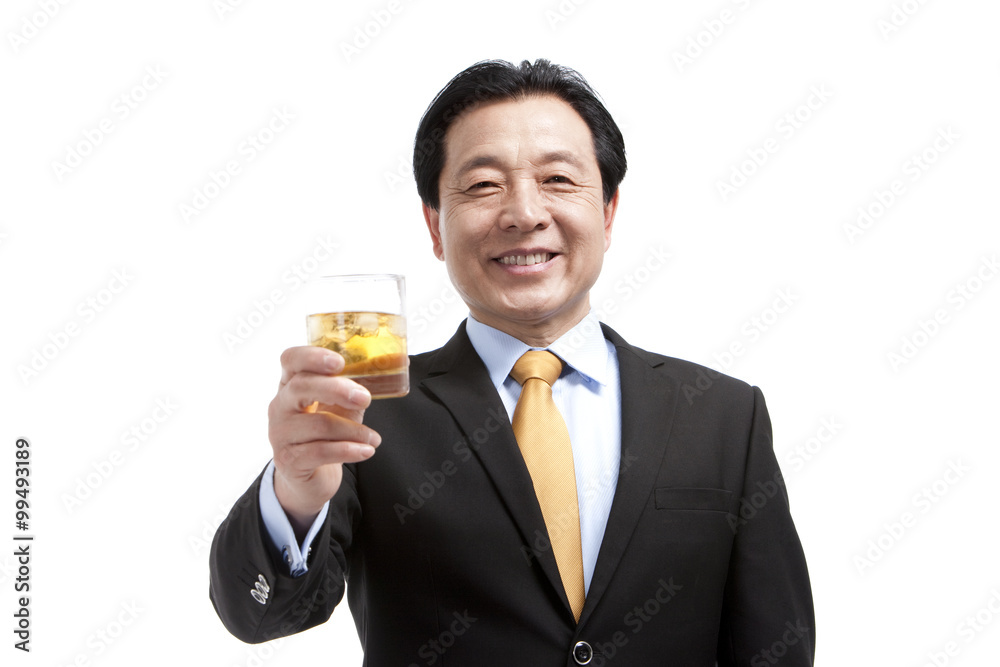 Senior businessman holding a glass of whiskey Senior businessman holding a glass of whiskey