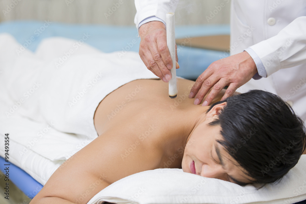 Obraz premium Patient receiving moxibustion