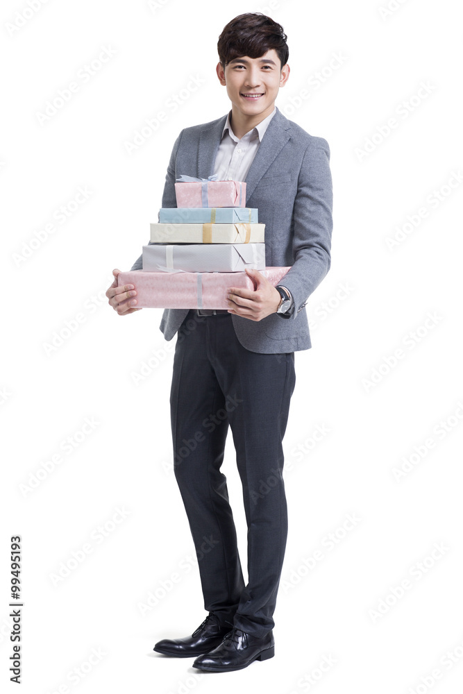 Happy young man holding many gifts Happy young man holding many gifts