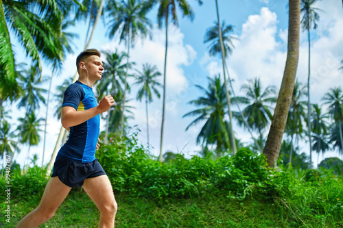 Healthy Lifestyle. Fit Athlete Male Jogger Running On Road, Training For Marathon Run. Athletic Sporty Runner Man Jogging During Workout Outside. Sports And Fitness. Wellness. Health Conscious Concept