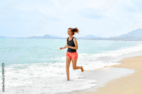 Wallpaper Mural Fitness. Sporty Young Female Runner Running On Beach. Athletic Fit Woman Jogging During Workout Outside. Sports, Exercising, Healthy Lifestyle. Health Concept Torontodigital.ca