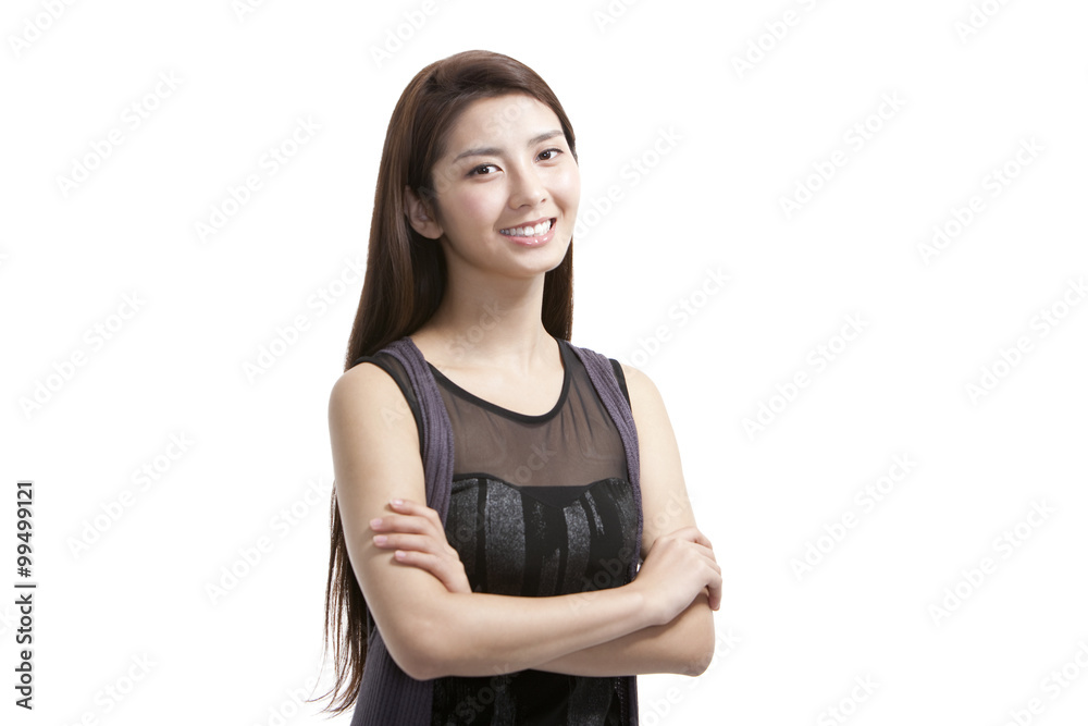 Beautiful  young woman standing with arms crossed