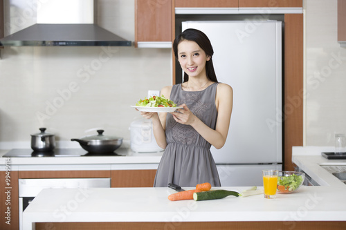 Young woman cooking in the kitchen