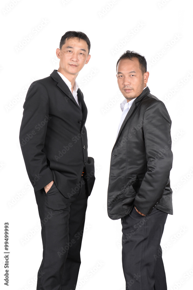 Two young businessmen look determined and confident, on white ba Two young businessmen look determined and confident, on white ba