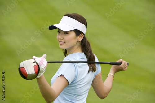Female golfer holding a club