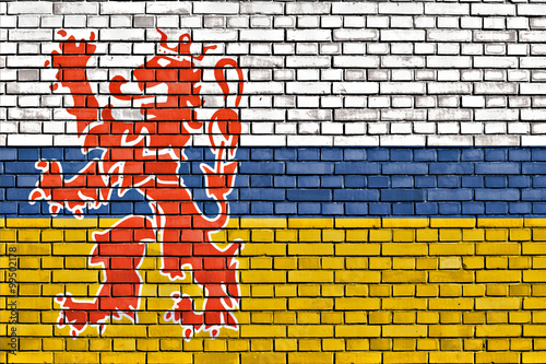 flag of Limburg painted on brick wall