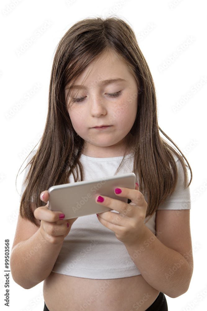 Studio shot of a cute girl playing on a smart phone Studio shot of a cute girl playing on a smart phone