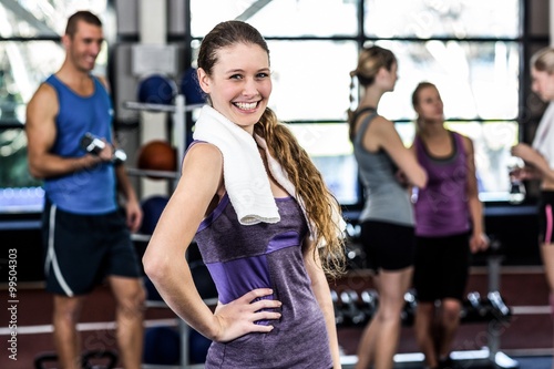 Smiling woman posing with hands on hips