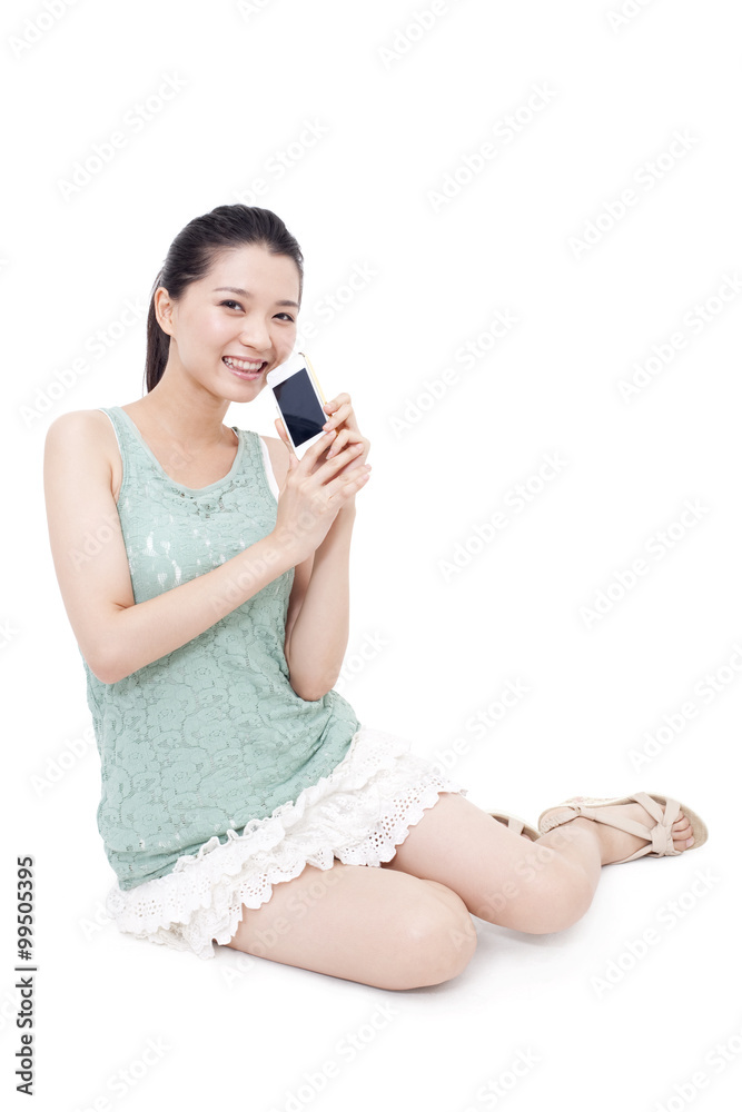 Happy young woman showing a mobile phone Happy young woman showing a mobile phone