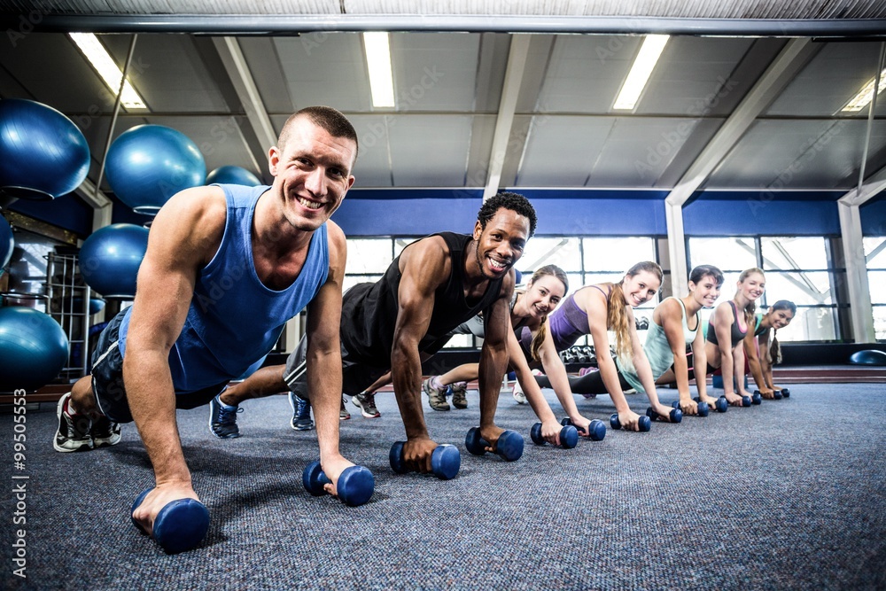 Fototapeta premium Fit people working out in fitness class