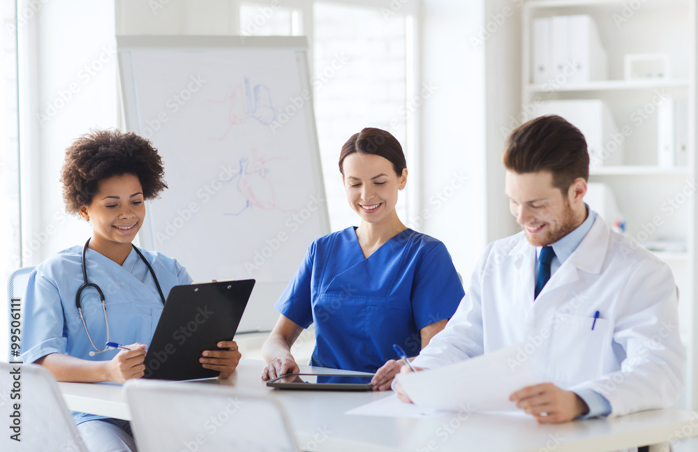 group of happy doctors meeting at hospital office group of happy doctors meeting at hospital office
