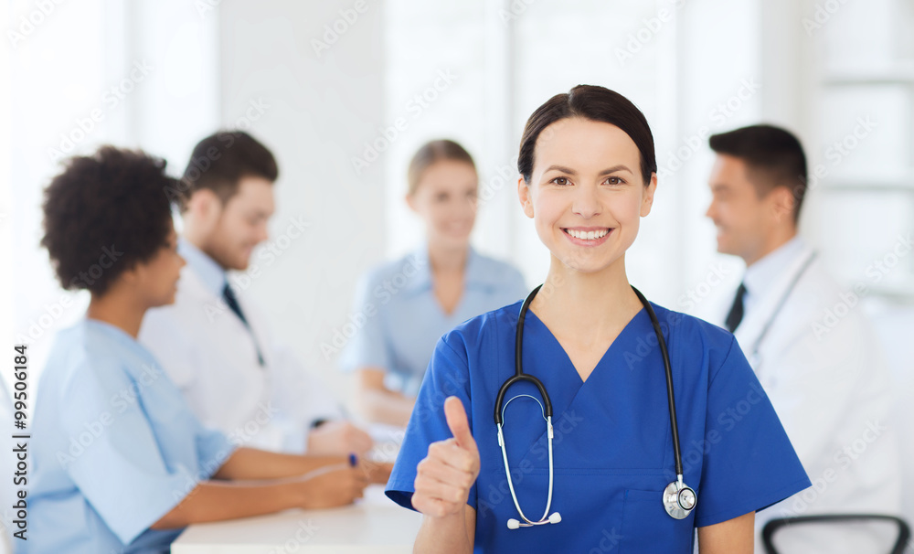 happy doctor over group of medics at hospital happy doctor over group of medics at hospital