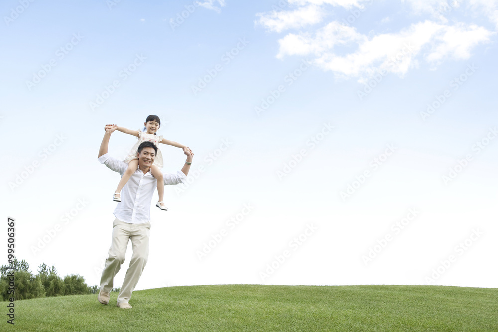 Father and daughter playing in the park Father and daughter playing in the park