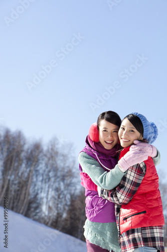 Happy young women in ski resort