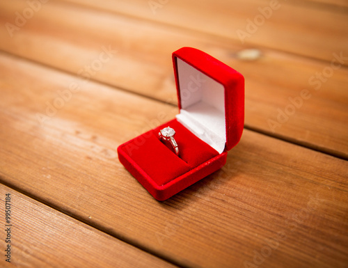 фотографія close up of gift box with diamond engagement ring