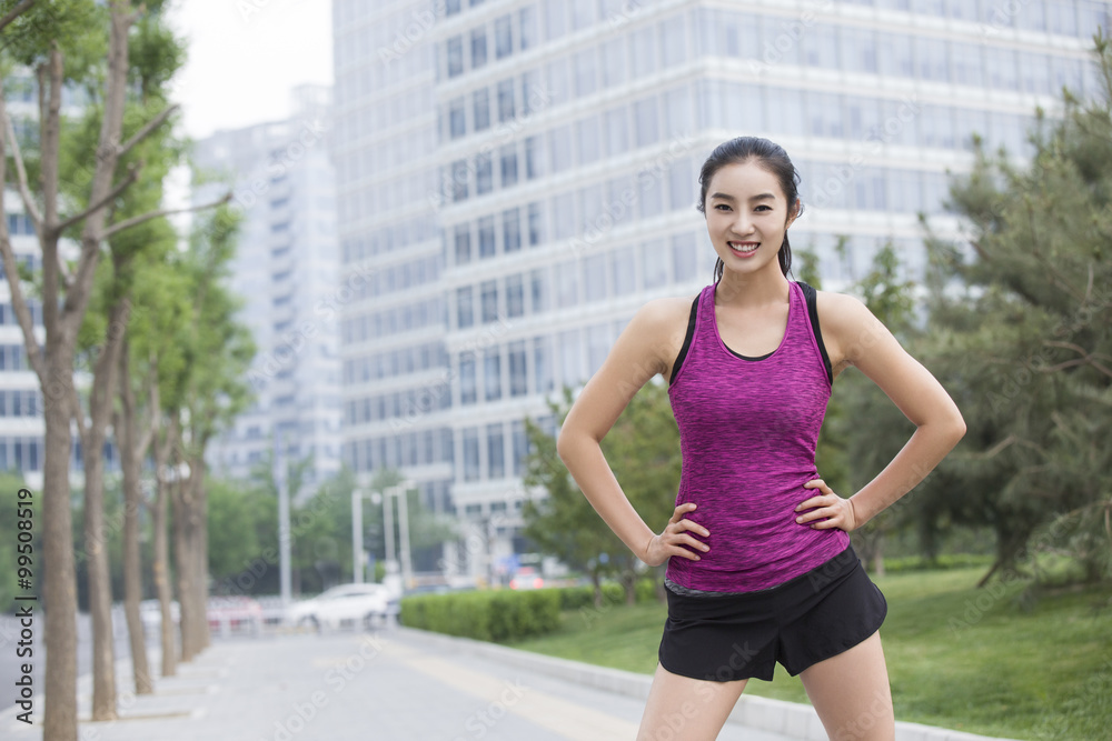Young woman doing exercise outside