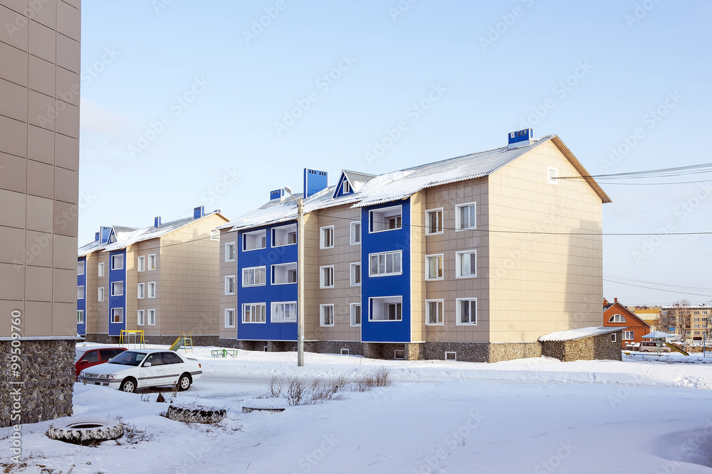 Modern three-storey brick house in a new area of the city Modern three-storey brick house in a new area of the city