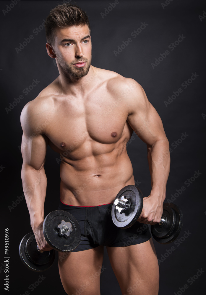 handsome young bodybuilder with toned body posing shirtless handsome young bodybuilder with toned body posing shirtless