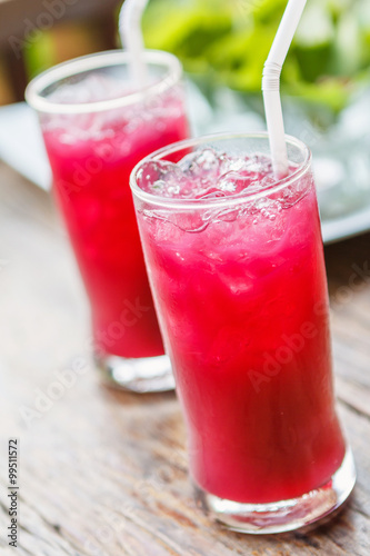 Glass of Roselle juice with ice. Traditional beverage.