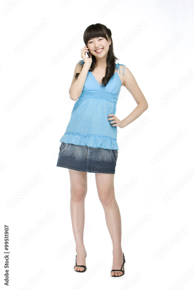Fototapeta premium Young woman using cell phone
