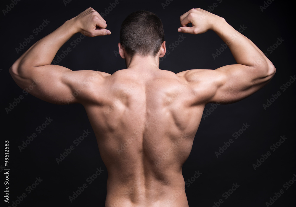 handsome young bodybuilder with toned body posing shirtless handsome young bodybuilder with toned body posing shirtless